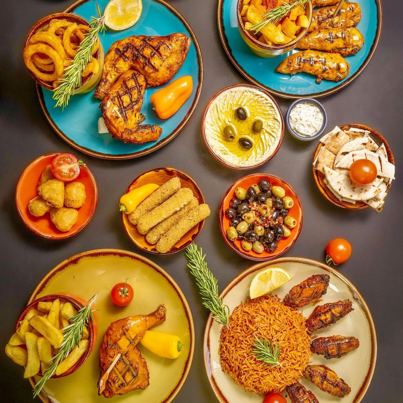 Catering food spread with peri-peri chicken and sides