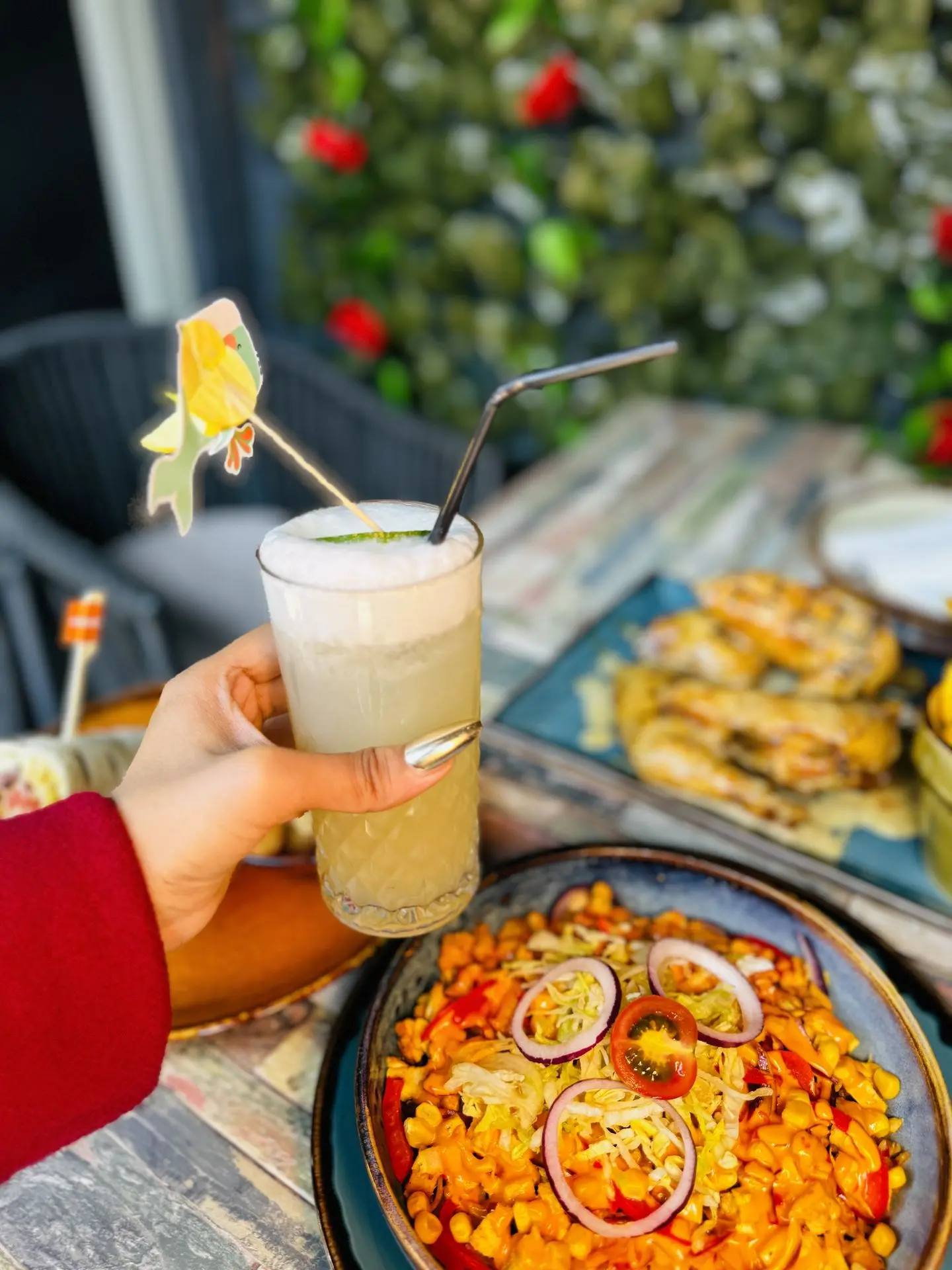 Loaded peri peri rice bowl with sweetcorn, peppers and salad, served with a fresh drink